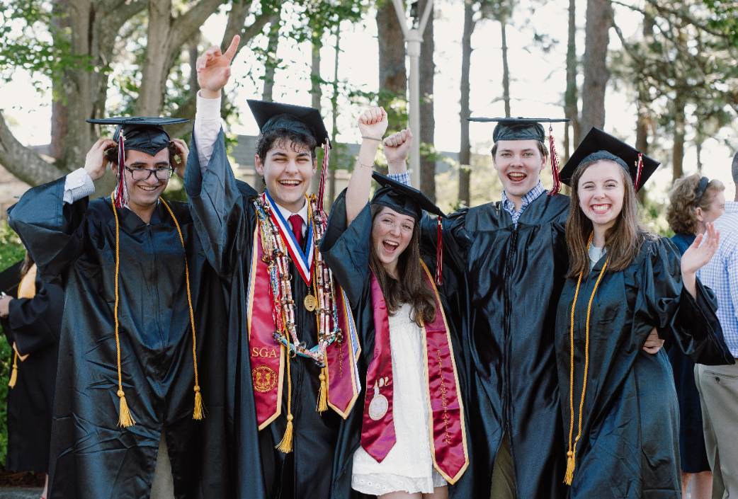 students cheering at graduation