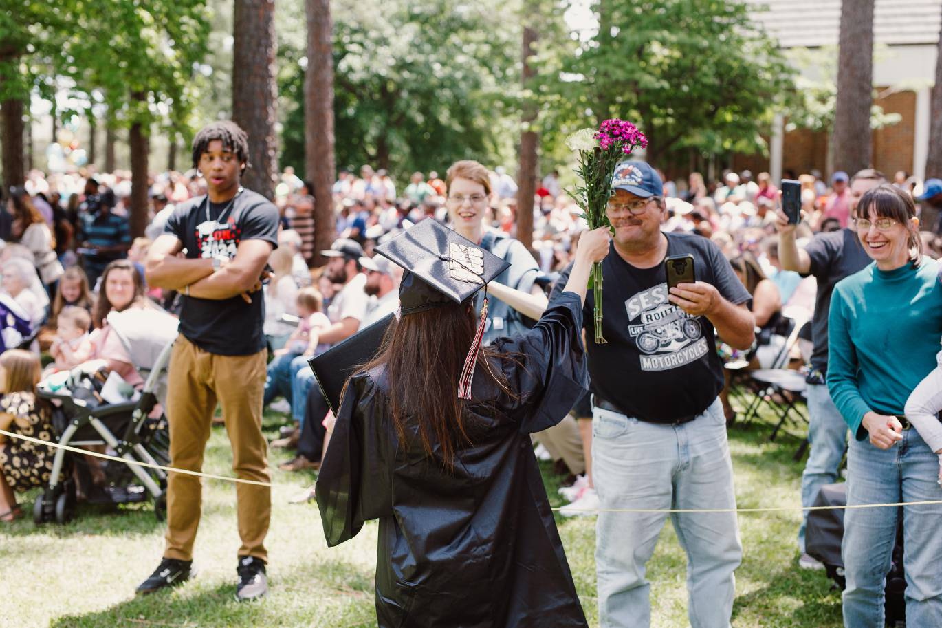 Graduate talking to family