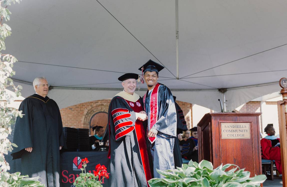 president shaking graduates hand