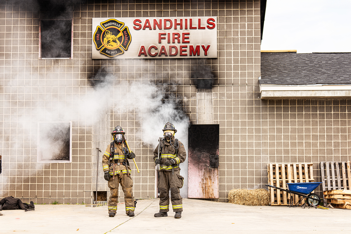 two students in fire fighter uniform