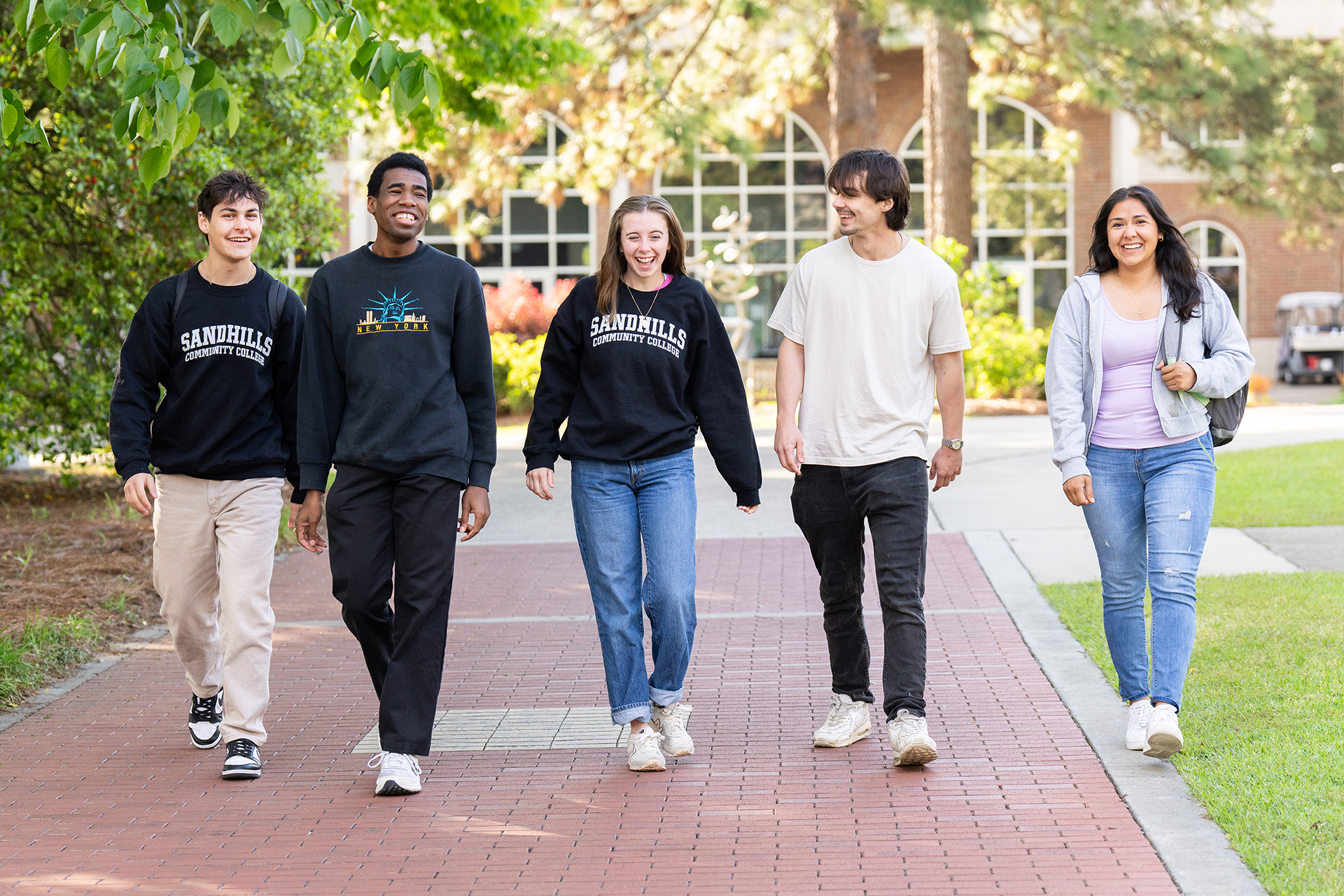 Five Students walking on campus