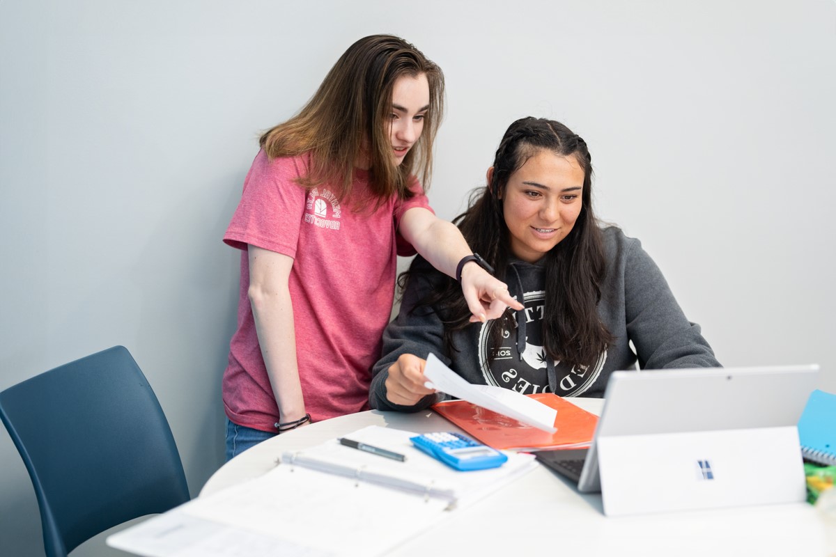 two students with laptop