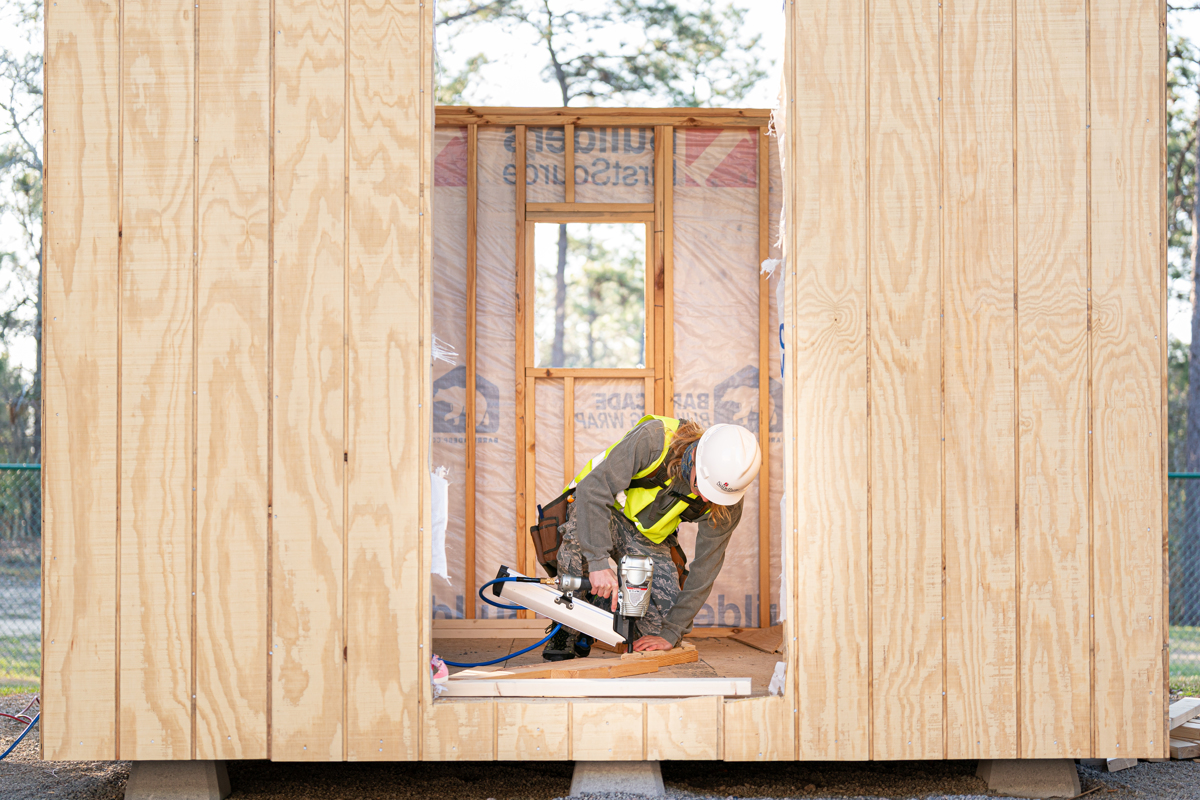Student building tiny home