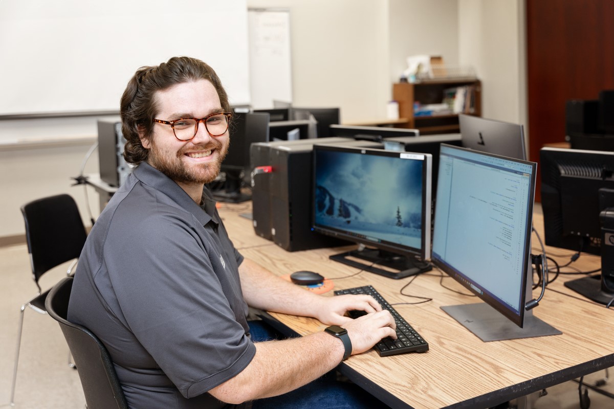 student with computer
