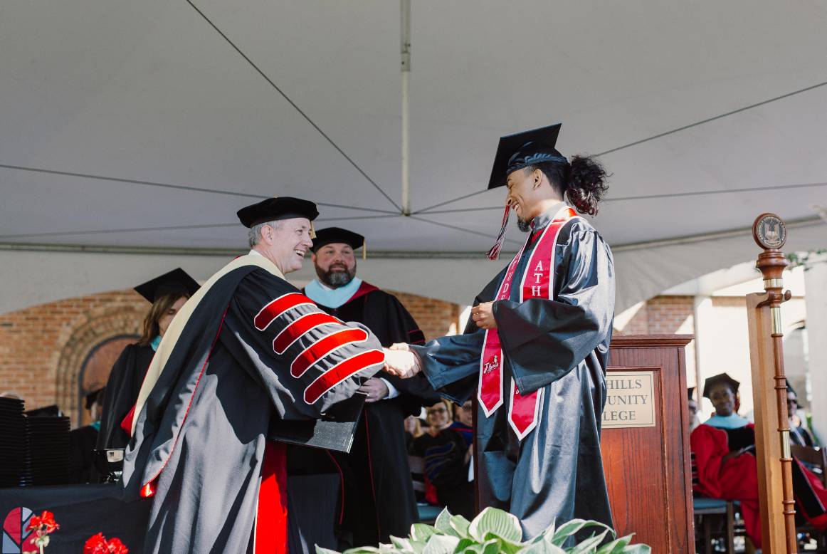 graduate with college president