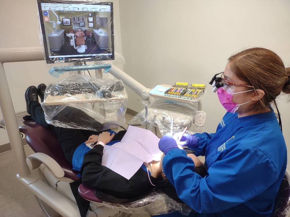 dental student with patient