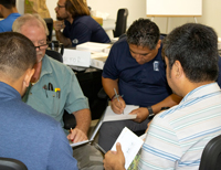 Training session recently held at PTT in Raeford, North Carolina, with facilitator and staff members.