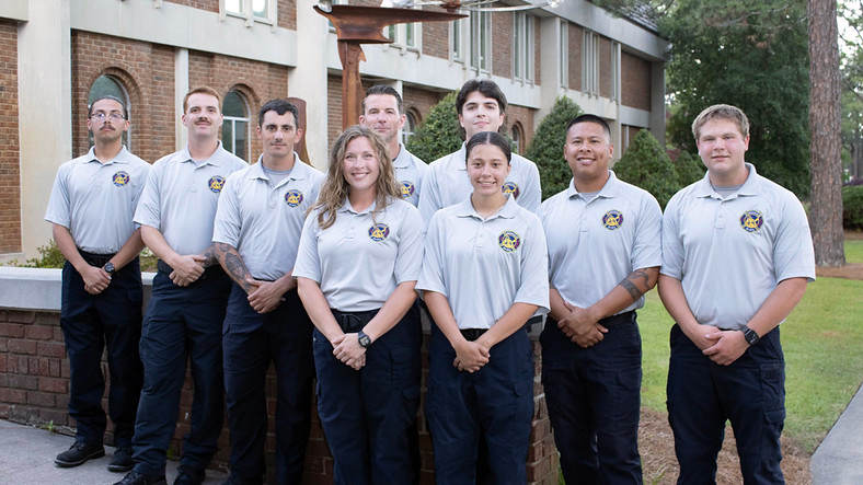 Graduates of the Sandhills Community College Fire Academy pose for a group photo on campus following completion of their training program.