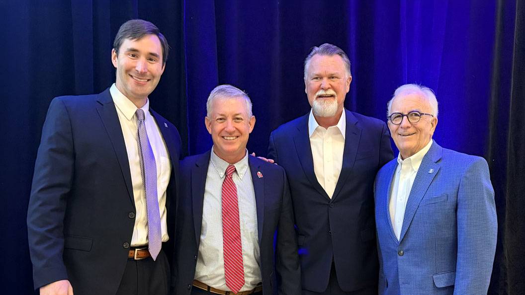 Alex Fagg, Sandy Stewart, Monty Sullivan and Tom Looney pose together at a North Carolina Community College System event.