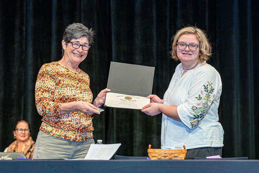ABE/HSE instructor Pat Watts, left, presents Adult Basic Education student Audrey Dunstan with a National Adult Education Honor Society certificate.