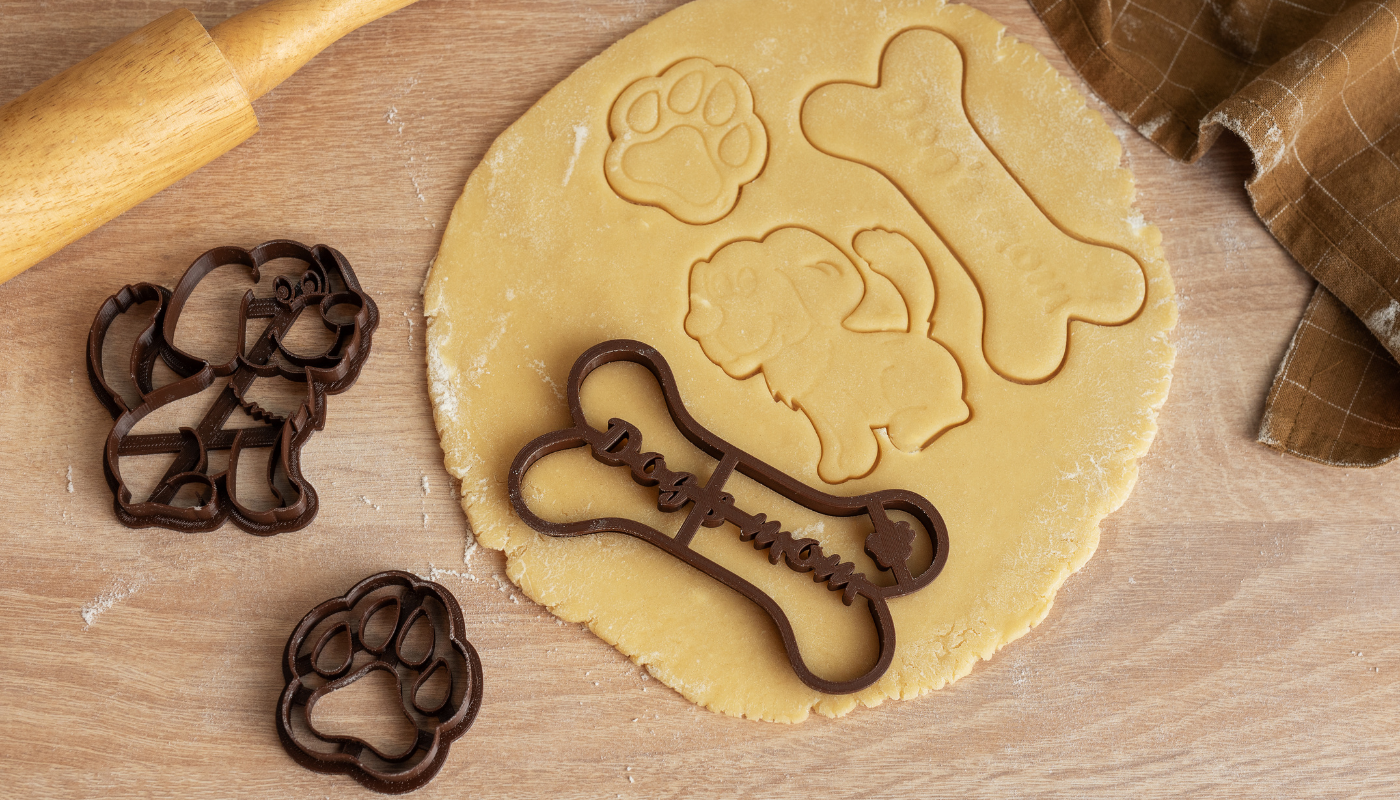 Pictured is a countertop with homemade dog treats being made. 