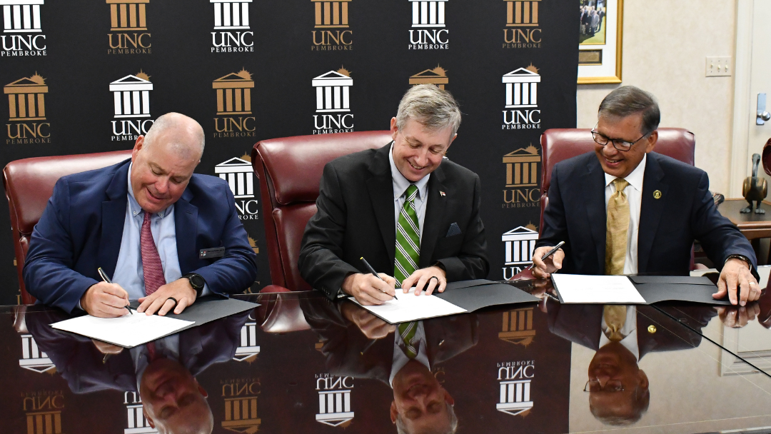 Sandhills Community College President Sandy Stewart, Moore County Schools Superintendent Tim Locklair, and the University of North Carolina at Pembroke Chancellor Robin Cummings were in attendance.