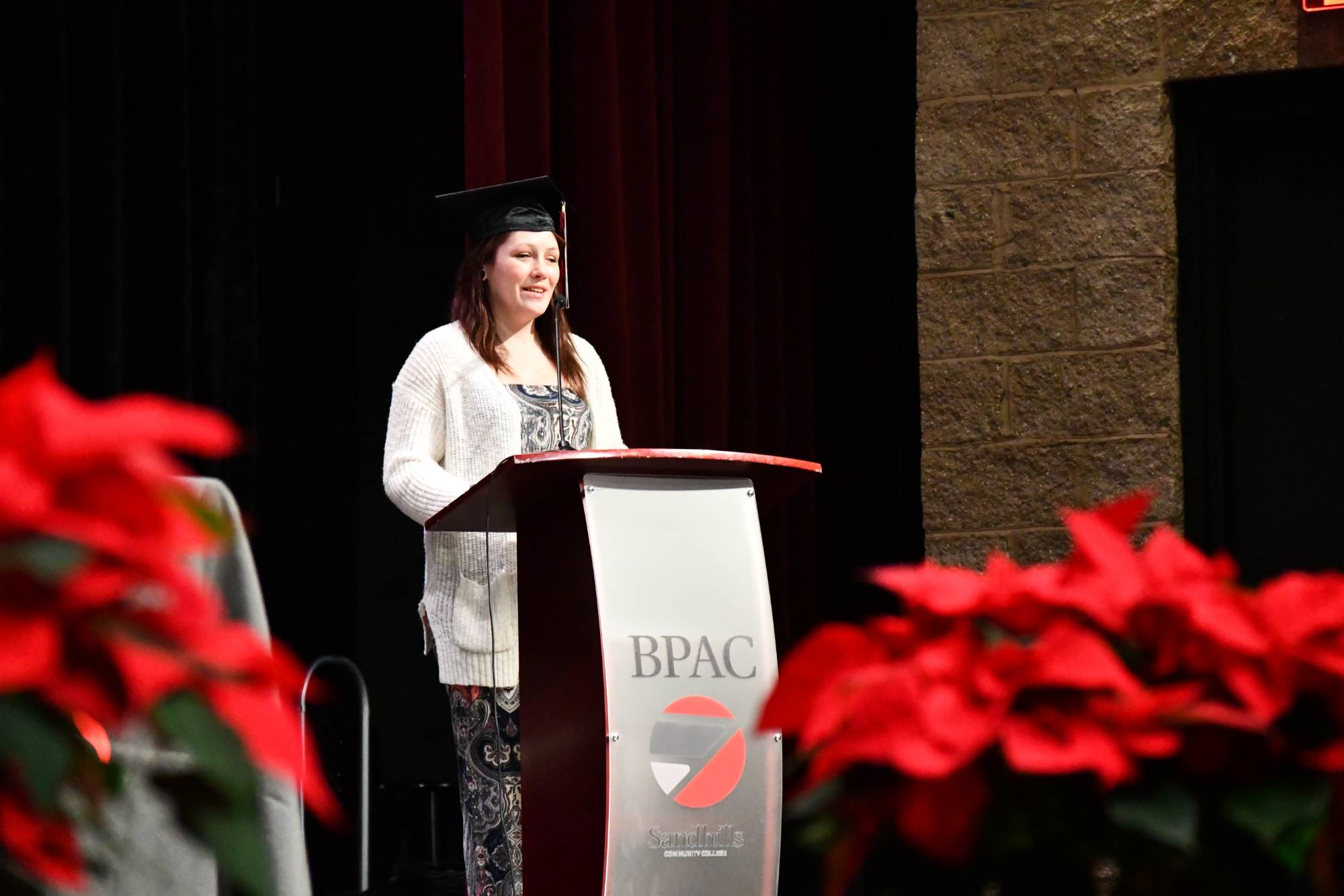 Student graduate Shyla Nelson at the podium